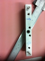 <h5>Cool Tool</h5><p>I designed a tool for drilling the new holes at the wing spars and fuel tank skins.
I had to adapt the original 3/32 holes to the bolt size used for the tank to attach the spars
</p>
